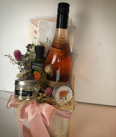Gift in a pot, wine, flower seeds, cooking spices 